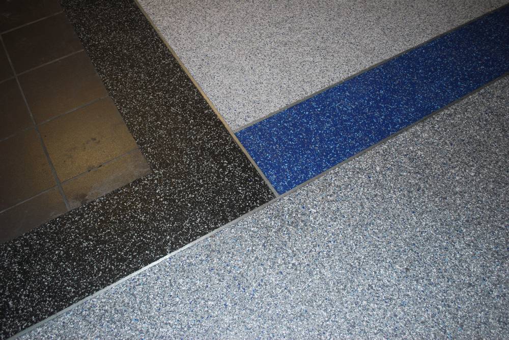Various color blends of decorative vinyl chips create an aesthetically pleasing floor.