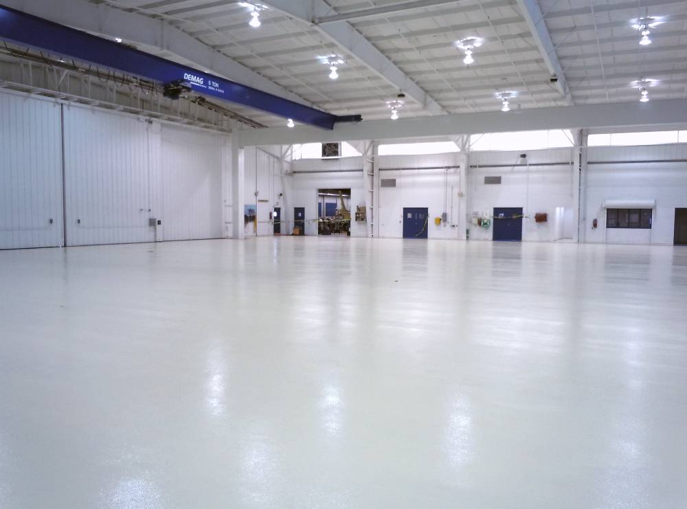 Epoxy floor coating provides easy to clean protection against traffic, impacts, and fuel spills.