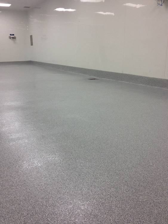 Finished urethane mortar floor with drain sloping.