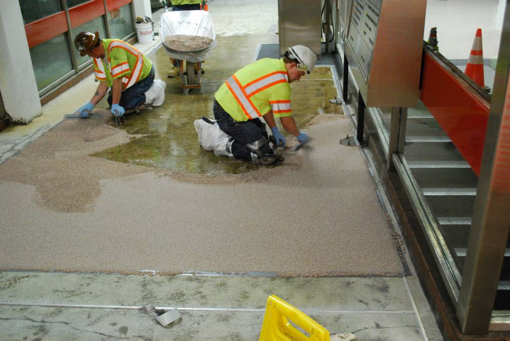 Epoxy mortar is applied at the 8th and Market station.