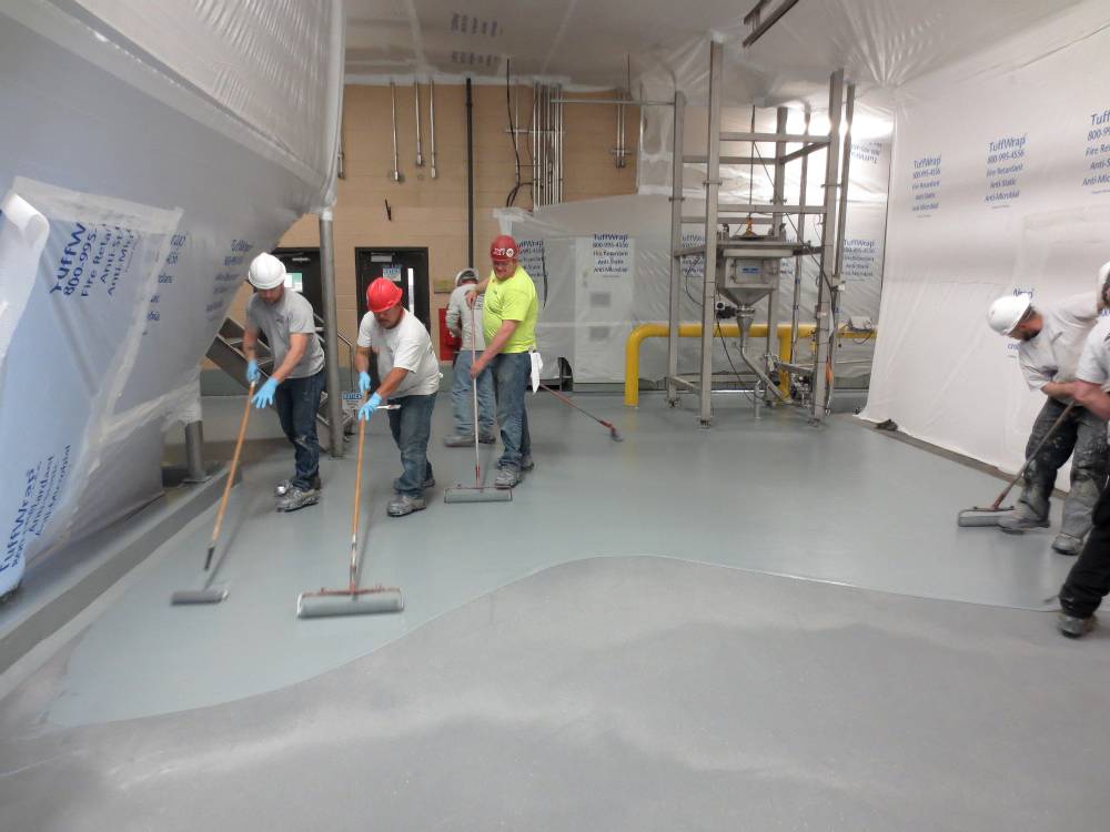 Final poly aspartic coat is applied to floor surface, sealing the slip resistant aggregate and adding a final layer of protection.
