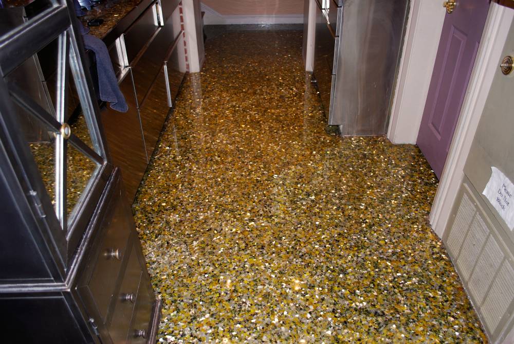 PermaFloor created this floor effect using recycled glass and crushed mirrors suspended in a deep gloss urethane.